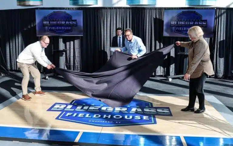 City officials remove a cover to reveal the Bluegrass Fieldhouse logo